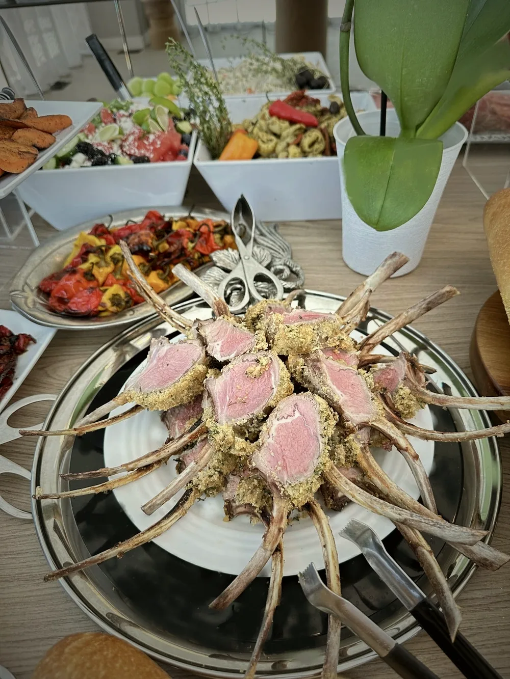 Carved entrée presentation on a silver platter