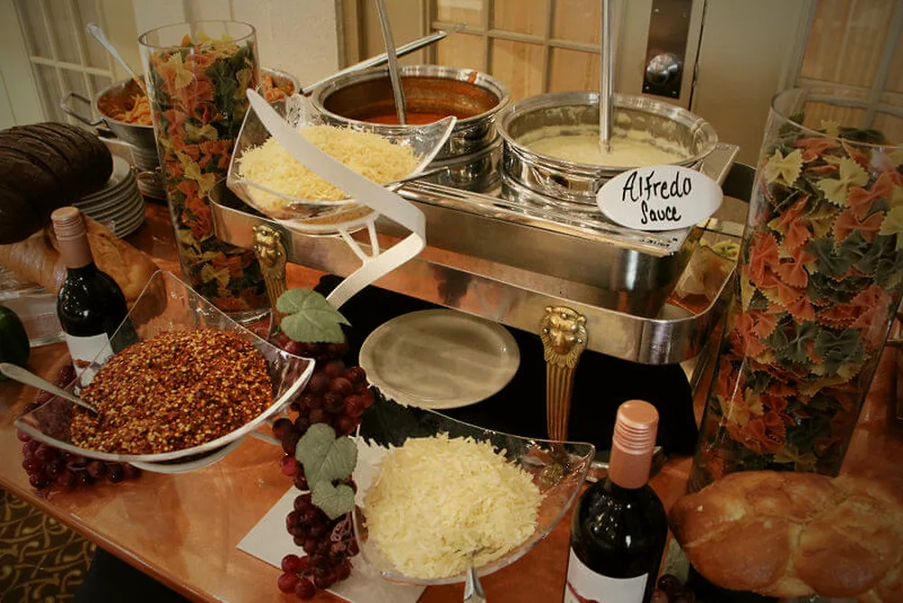 Pasta action station with fresh cheeses and sauces